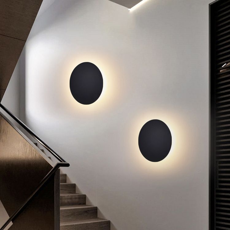 Minimalist round wall sconce with halo LED illumination by BROKLEN – view 3