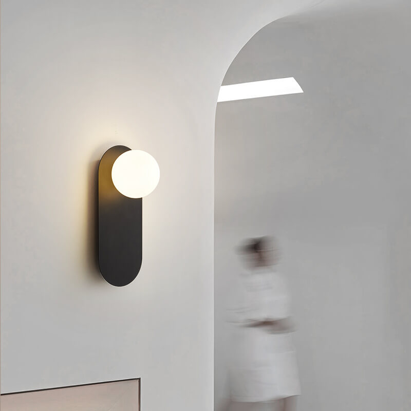 Minimalist Nordic globe wall sconce with oval backplate by BROKLEN – view 2