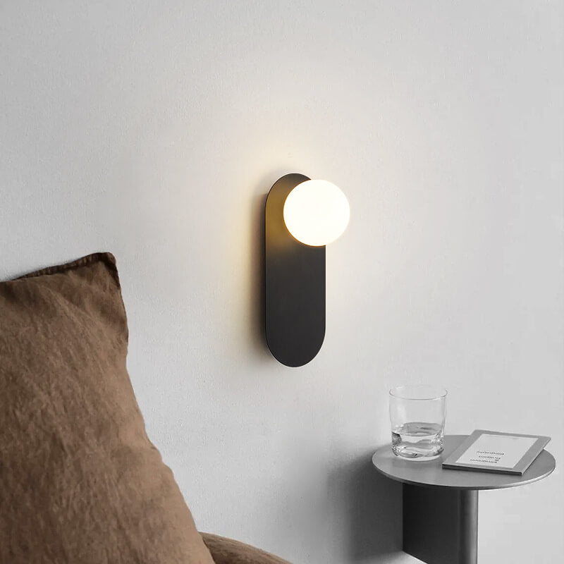 Minimalist Nordic globe wall sconce with oval backplate by BROKLEN – view 3