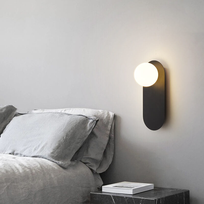 Minimalist Nordic globe wall sconce with oval backplate by BROKLEN – view 4