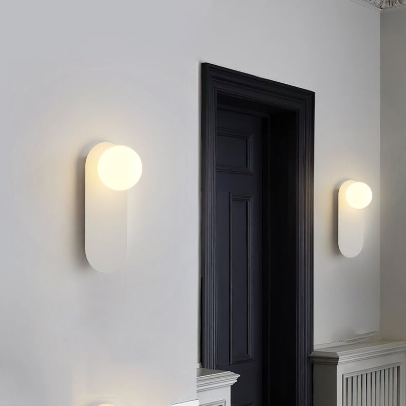 Minimalist Nordic globe wall sconce with oval backplate by BROKLEN – view 5