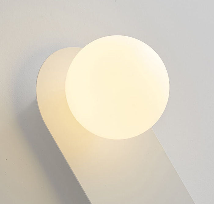 Minimalist Nordic globe wall sconce with oval backplate by BROKLEN – view 7