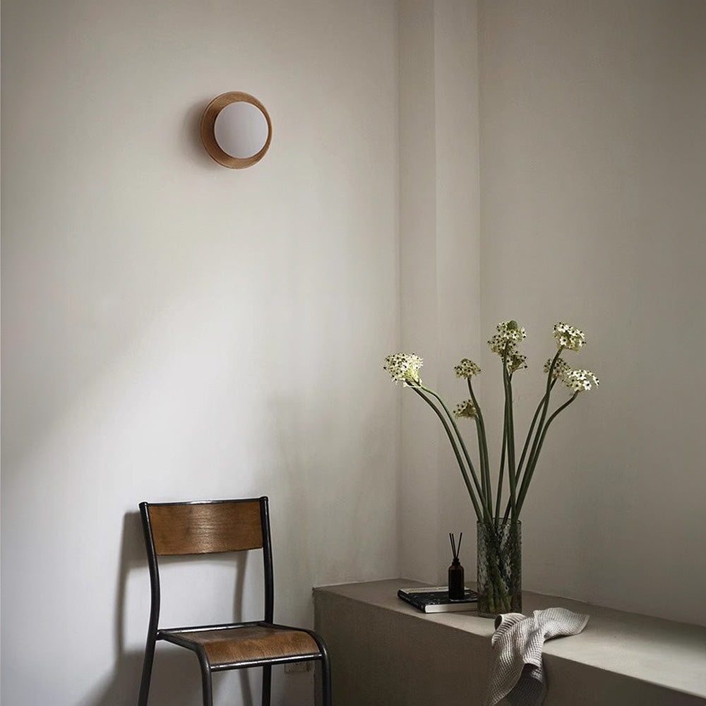 Round wooden wall light with frosted globe shade by BROKLEN