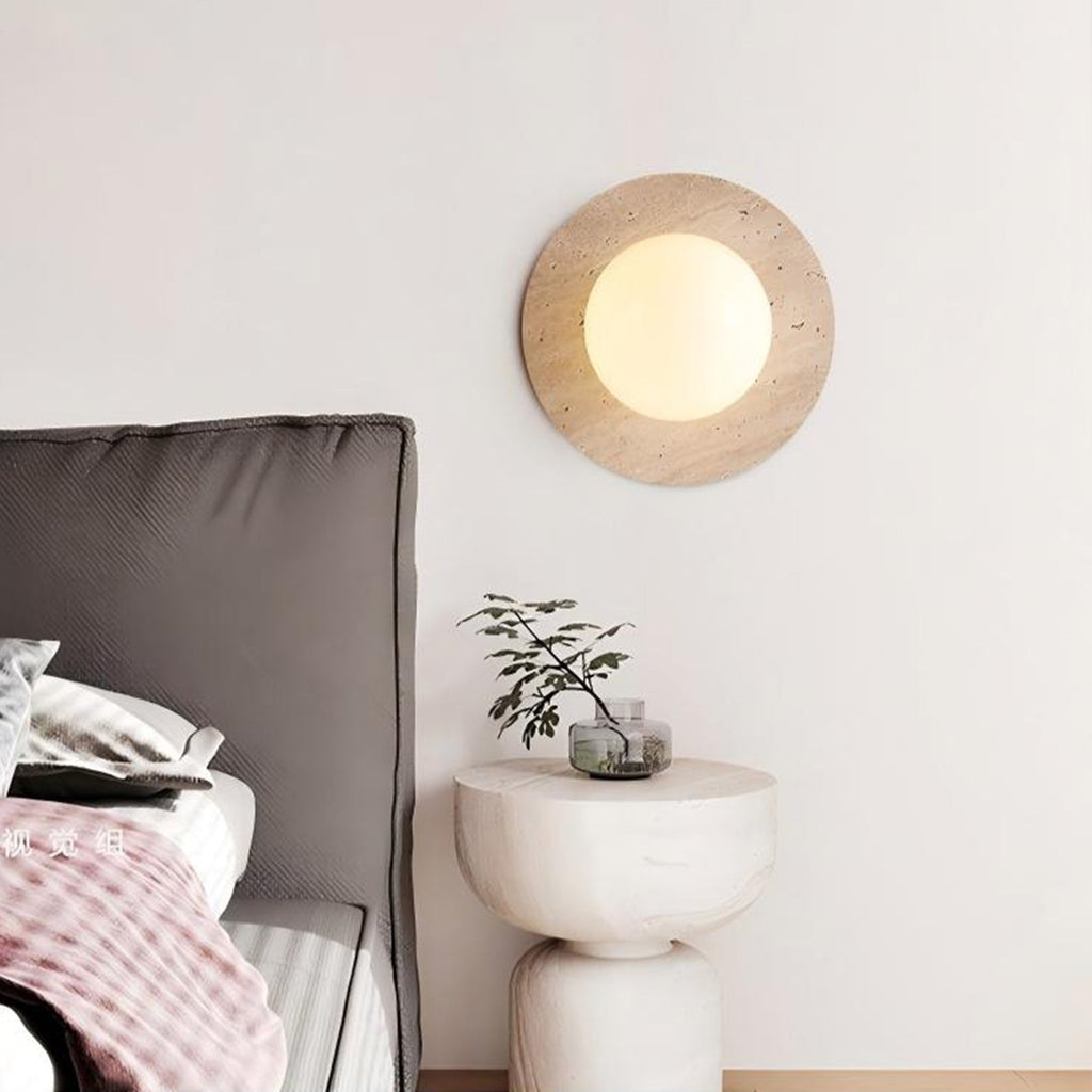 Natural travertine wall sconce with frosted globe by BROKLEN