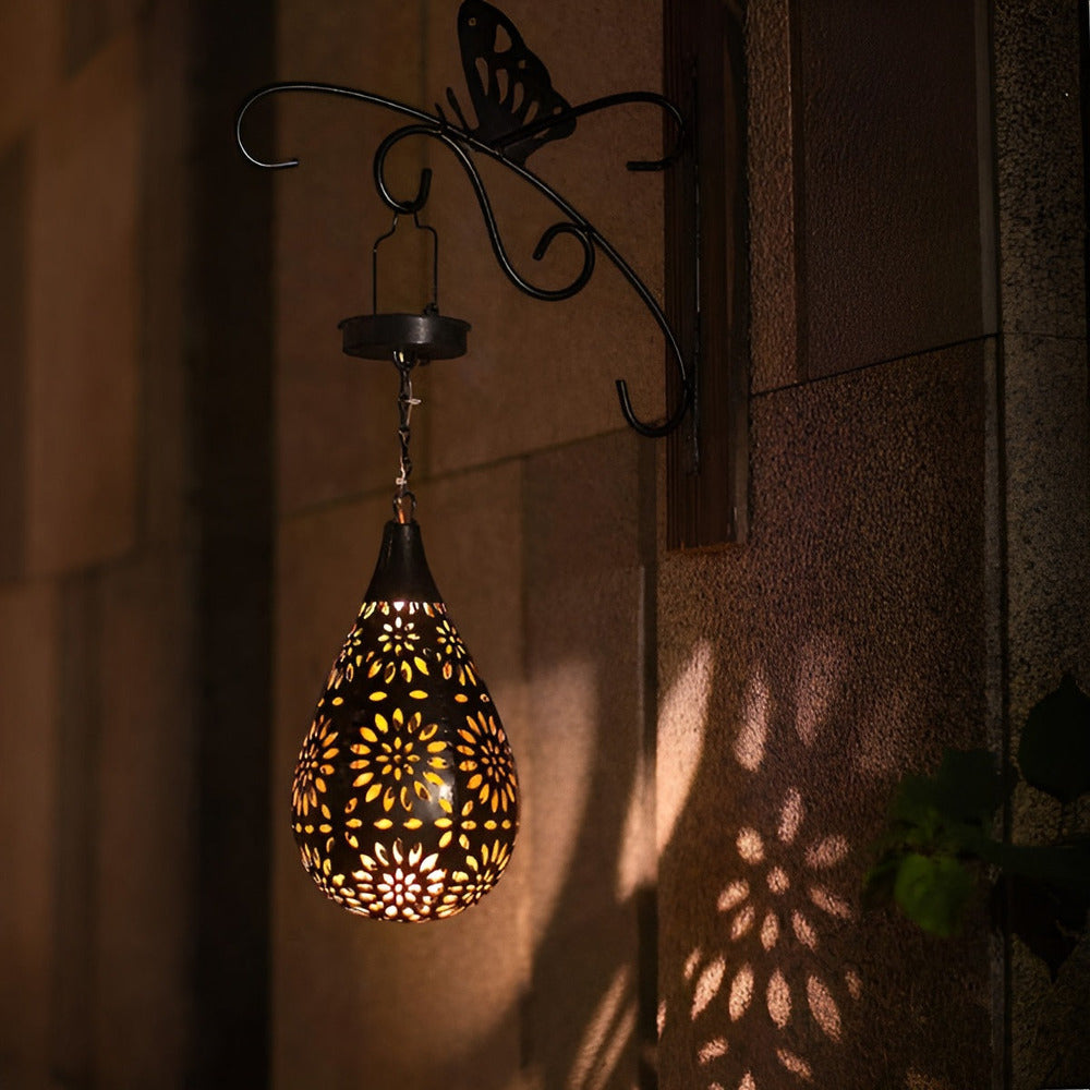 Black solar metal lantern with decorative cut-out pattern by BROKLEN