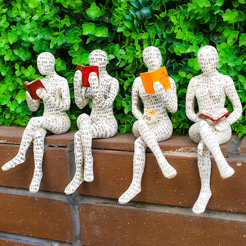 Modern resin book lover statue of a reading woman by BROKLEN – view 2
