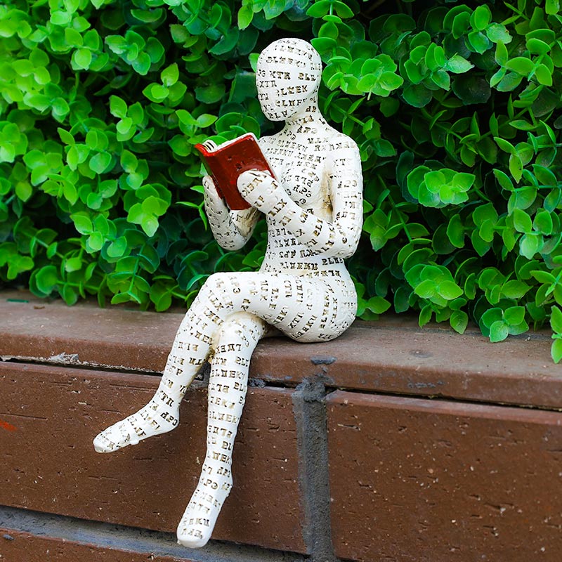 Modern resin book lover statue of a reading woman by BROKLEN – view 11