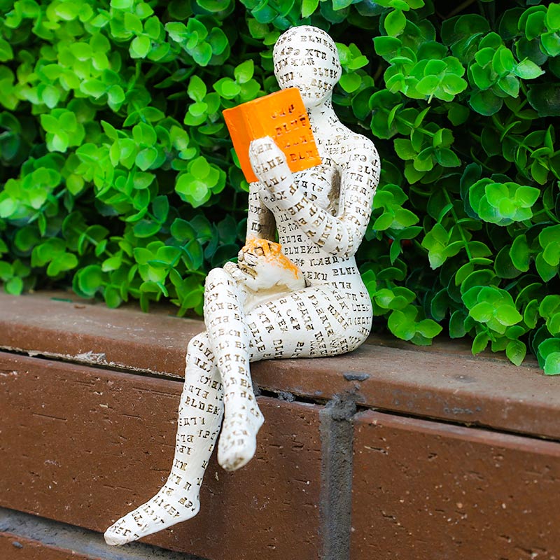 Modern resin book lover statue of a reading woman by BROKLEN – view 12