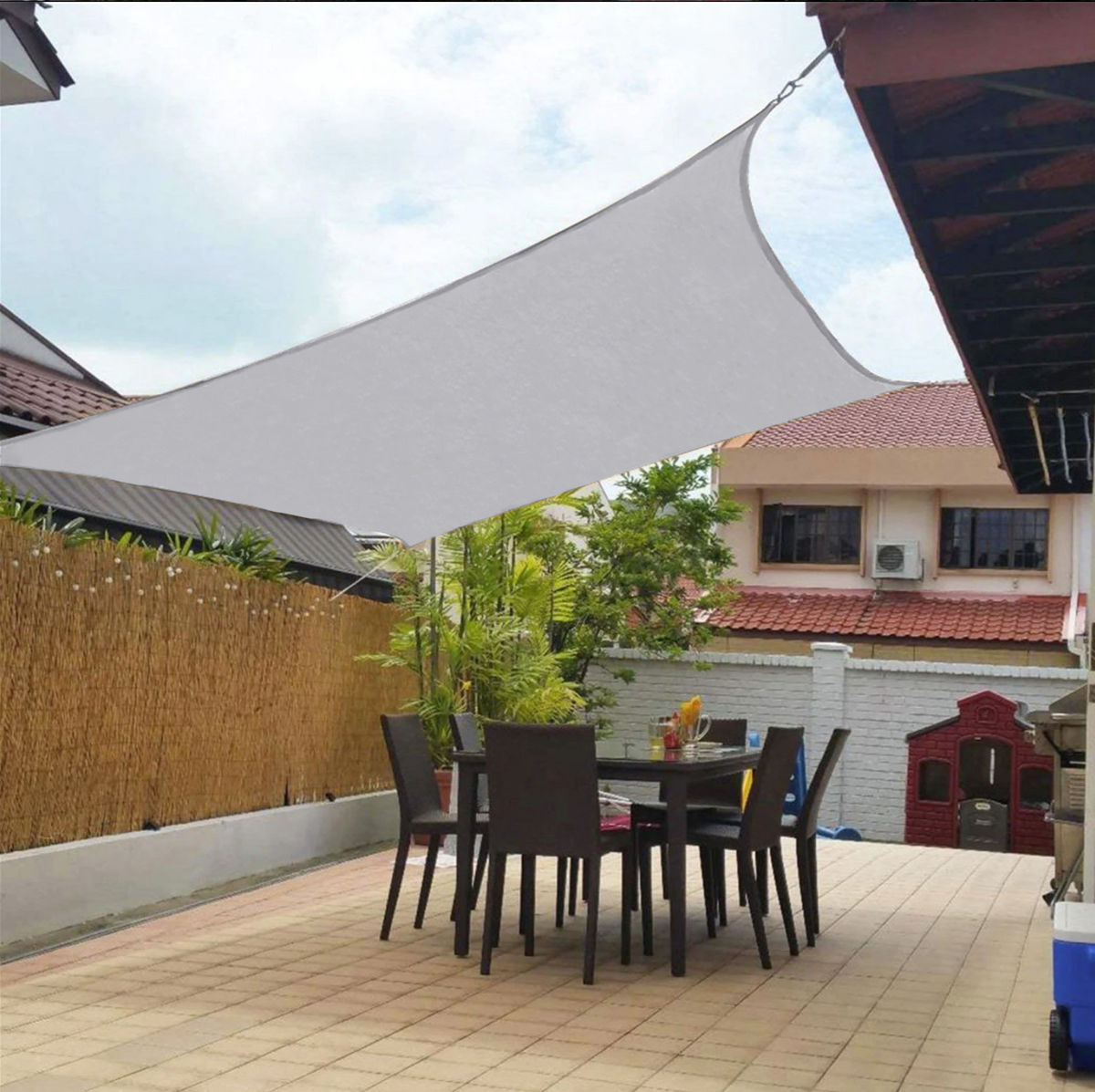 Outdoor shade sail canopy sun shelter over a patio by BROKLEN – view 3