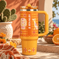 Golden Fiesta Tumbler - orange folk floral insulated tumbler, front view