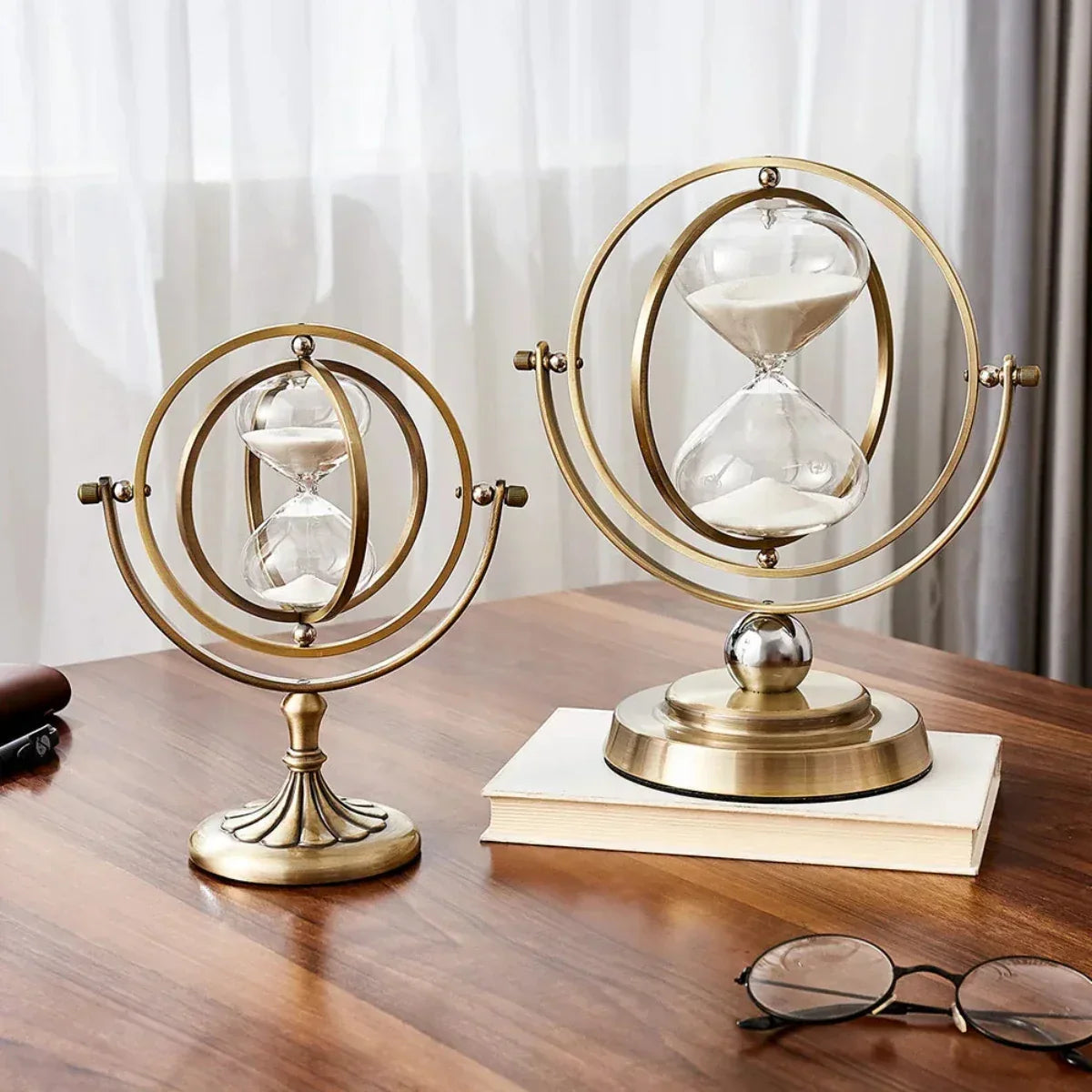 Hourglass sand timer in a circular metal frame by BROKLEN – view 2