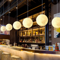 Lunar Glow moon pendant light in resin and fibre by BROKLEN – view 3