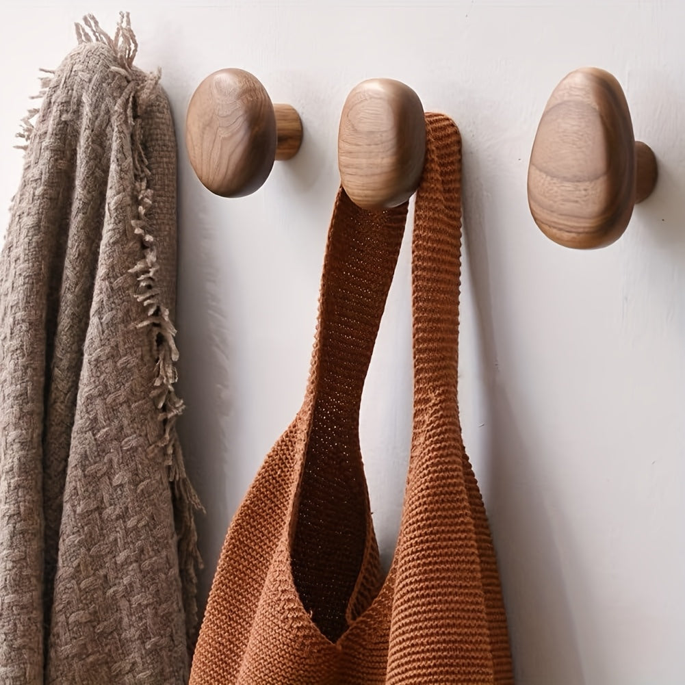 Set of four round pebble shaped wooden wall hooks by BROKLEN – view 2