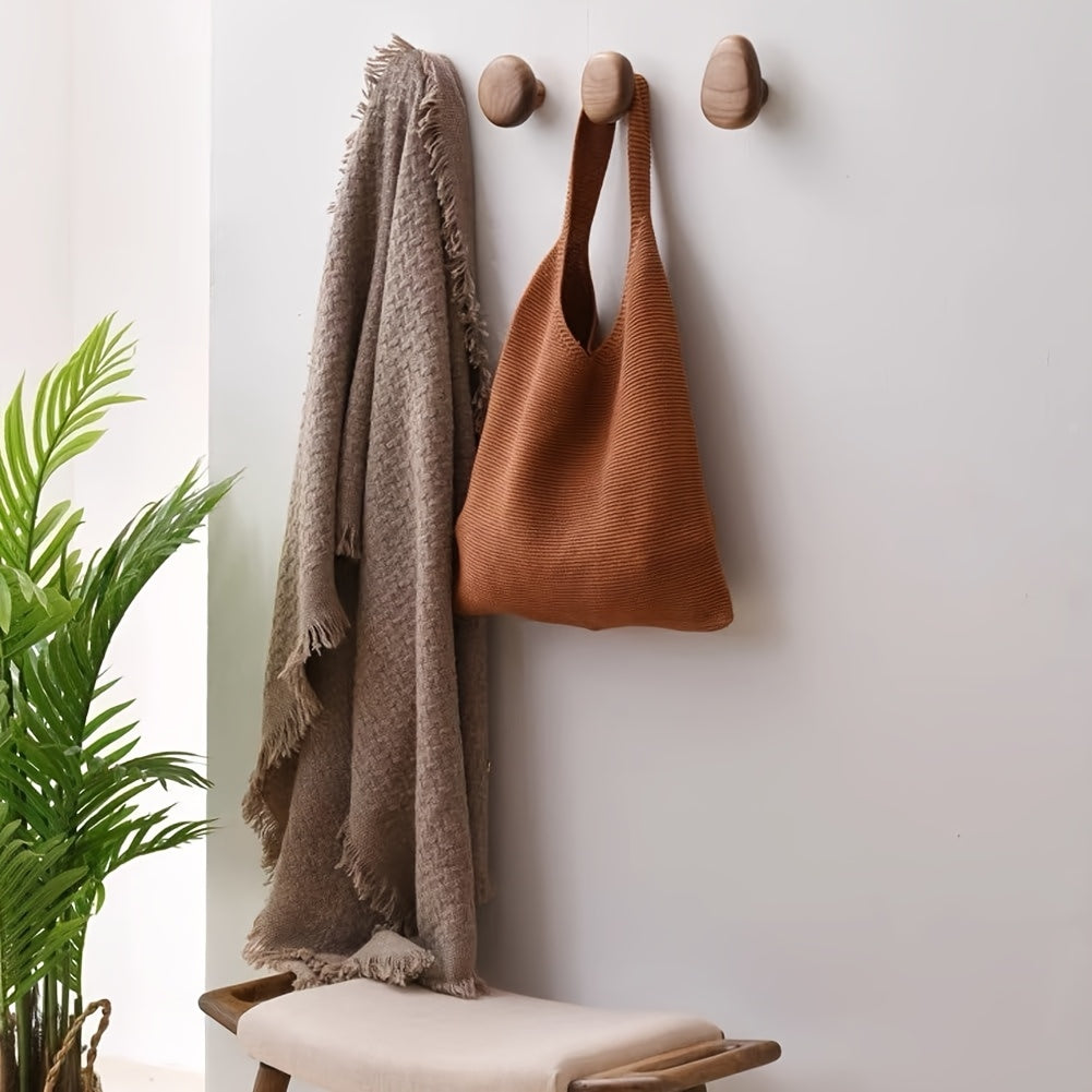 Set of four round pebble shaped wooden wall hooks by BROKLEN – view 3